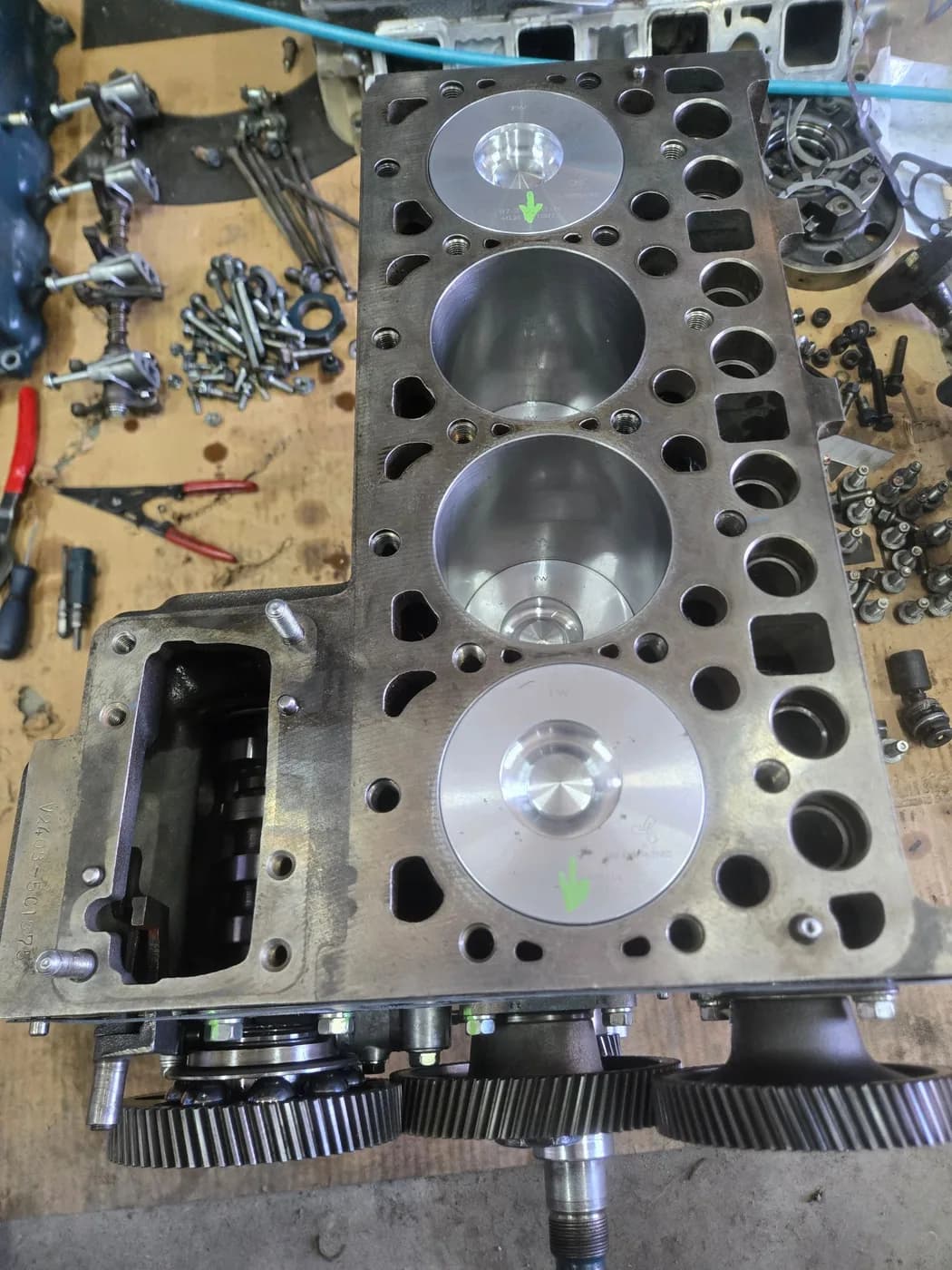 Rebuilt Kubota V2403 short block with new oversize pistons fitted and the timing gear train assembled
