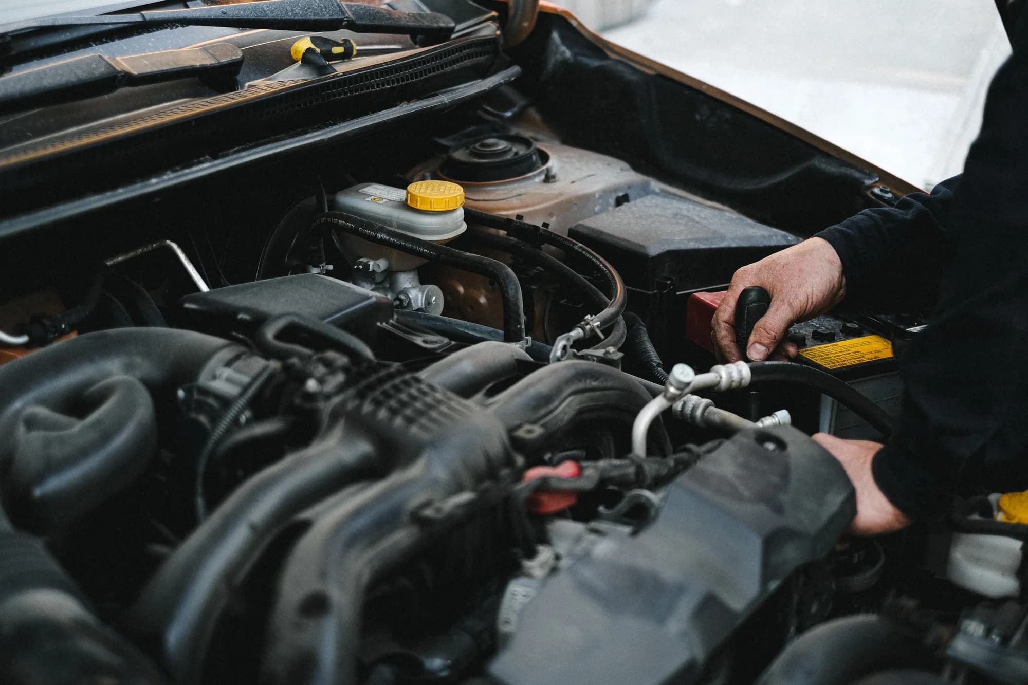 Technician working on a car engine at Eskimo Auto Repair in Edmonton